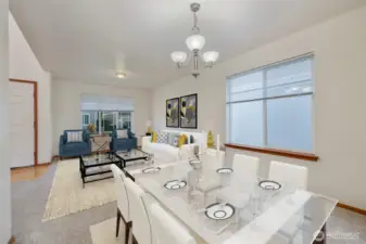 The gorgeous formal dining room flows effortlessly into the expansive room with the living room, enhancing the home's modern, open concept feel. Soft neutral-toned interior paint creates a timeless backdrop, ready to complement any style. Throughout space, elegance and comfort reign, offering a perfect balance for both relaxed living and refined entertaining.