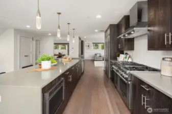 Top of the line appliances including a large Liebherr refrigerator and a double Thermador oven with 6 cooktops.