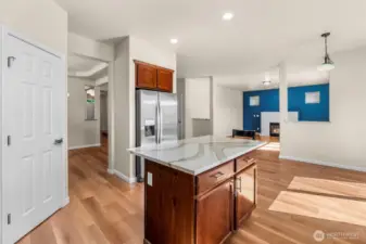 Kitchen towards entry way on left and living room to the right