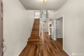 From front door. Office/den on right with double door.