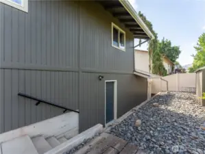 Back of the house with the garage door heading out back