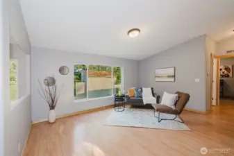 Living area with large windows and natural light.