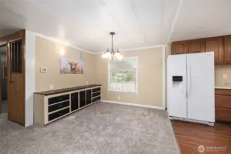 Formal dining area next to the kitchen features a built-in buffet for extra storage.