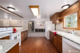 In the kitchen, looking back toward the dining area and the hallway