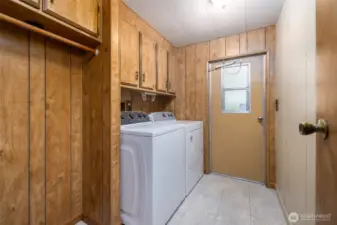 Laundry room with space to hang clothes to dry