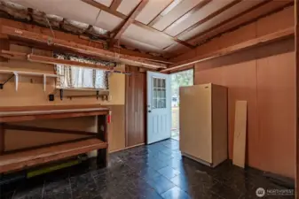 Extra fridge in workshop conveys with the home. You'll never have to worry about where to store all the Thanksgiving leftovers!