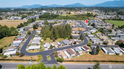 An aerial view of the Park Village community with #98 location marked with the red arrow.