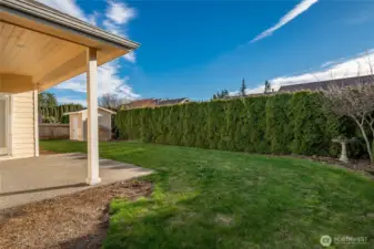 Low maintenance private backyard with covered patio