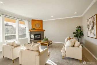 Living Room with new carpet, gas FP, 9' ceiling and lots of natural light