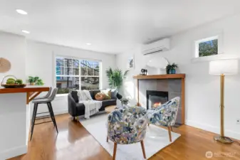 Generously sized family room just off the kitchen features a gas fireplace — ideal for everyday living. Mini split here for warm weather as well!