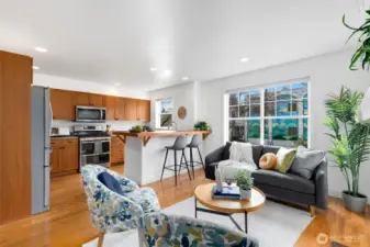 Well-appointed kitchen with ample cabinetry, stainless appliances, and bar seating for casual dining.