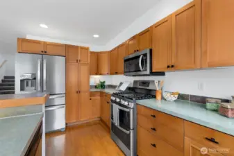 Spacious kitchen layout with abundant storage and workspace, designed for both efficiency and ease.