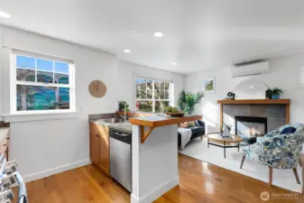 Natural light pours in with this fantastic western exposure while the gas fireplace anchors the adjacent family room.