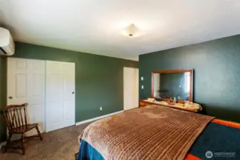 Primary bedroom with double closets.