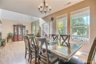 Dining room opens to the living room. Wall of Large windows