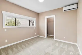 Primary Bedroom, sliding door to closet  space (goes to right and left with shelving) Mini split