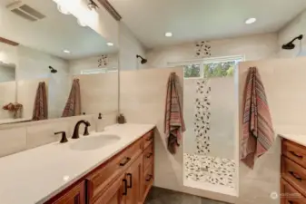 Spa-like ensuite bathroom with huge, walk-in shower and double vanity.