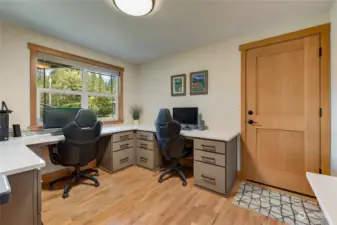 Dedicated office with built-ins.  The door shown opens to the garage.