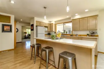Bright kitchen features large island.