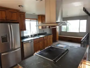 Check out this kitchen! Island with plenty of cabinets and countertops.