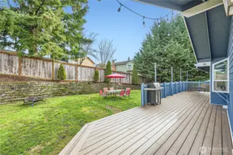 A huge trex deck with a nice level yard!