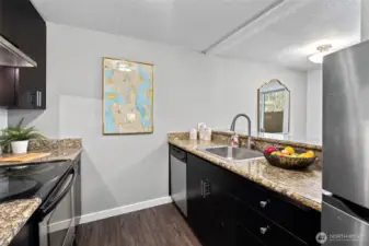 Galley style Kitchen with newer appliances and granite counters