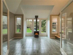 Bright & airy sun room with gas fireplace.