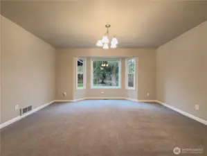Dining room with picture window looking into the large backyard