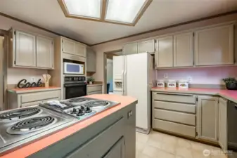 Kitchen features an island and pantry