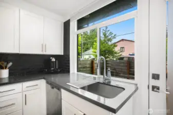 Quartz countertops and an undermount sink.