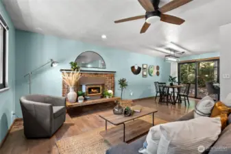 Living room with brick wood burning fireplace