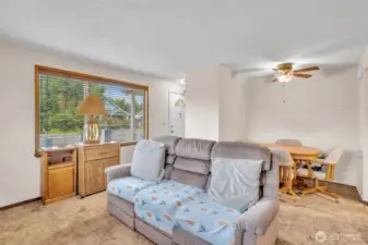Living room with ceiling fan.