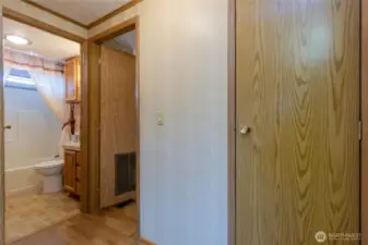 Hall leading to guest bath and laundry area