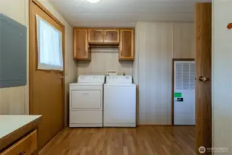 Laundry room with door to carport.