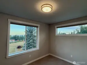 Secondary bedroom with views to Puget Sound and the Olympic Mountains.