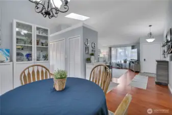 Dining room is open to front living room as depicted in this photo.