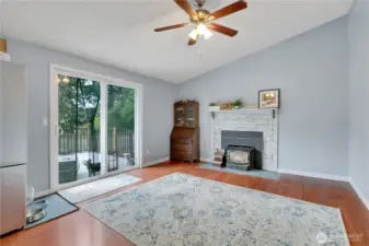 Large family room with sliding glass door to access deck and backyard.