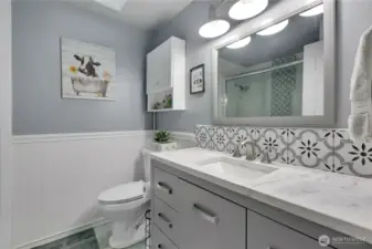 Spare/guest bath is updated with lots of beautiful tile detail.