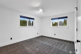 Comfortable main floor bedroom with convenient access to living spaces