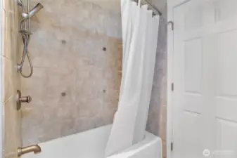 Well-designed bathroom serving the main living areas