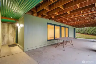 Covered space beneath the deck offering shaded outdoor enjoyment