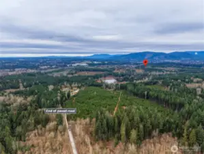 Arrive home through a private gated entrance surrounded by towering evergreens and peaceful woodland views. The scenic drive in creates an immediate sense of escape from the noise of everyday life.