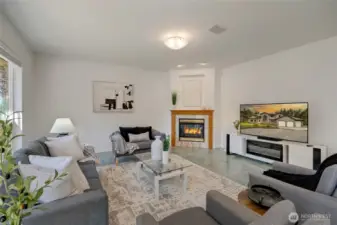 Seamlessly connected to the kitchen, the family room creates a warm and welcoming central gathering space. Surround sound enhances movie nights, game days, or relaxing evenings at home