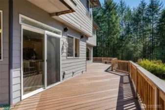 Nearly 1,000 square feet of wraparound decking expands everyday living outdoors. Host summer gatherings, outdoor dinners, or peaceful evenings under the stars.