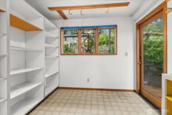 storage room off of kitchen for bikes and gear.