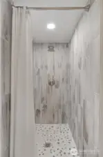 Tiled shower in 3/4 bath upstairs