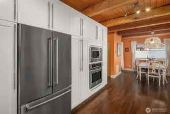 Stainless steel appliances seamlessly integrate into the cabinetry