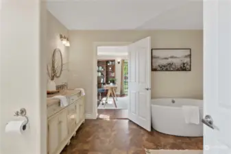 En suite primary bathroom with double vanity.