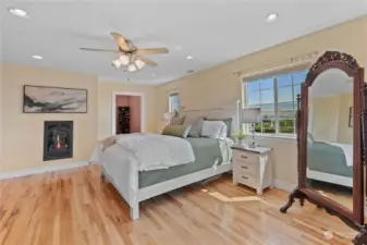 Stunning gas fireplace & hickory flooring.