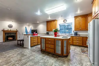 Kitchen looking into family room with cozy fireplace